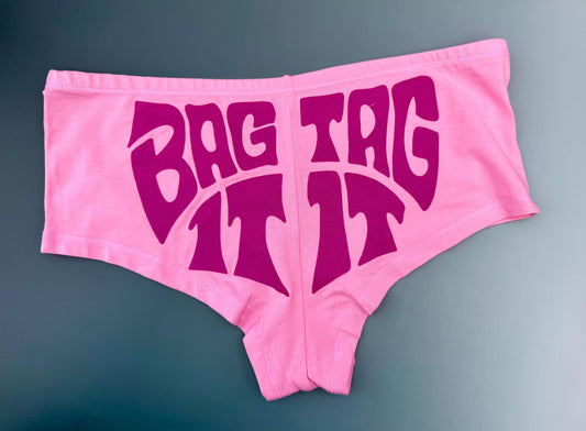 Bag It Tag It Panties – Pink Boyshorts with Hand-Drawn Lyric Graphic